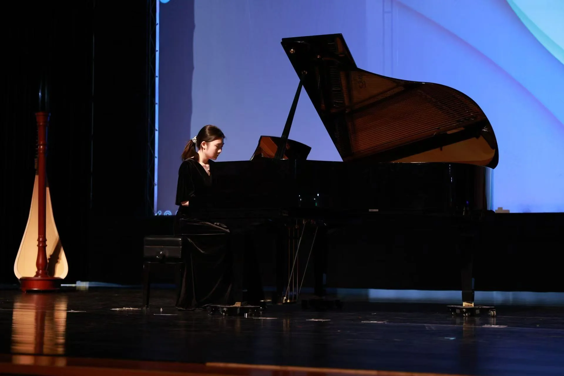 Alicia performing at the grand piano